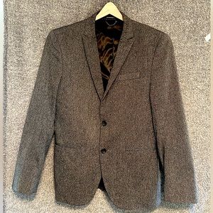Charcoal gray sport coat. Regular fit in size Small. In good condition.